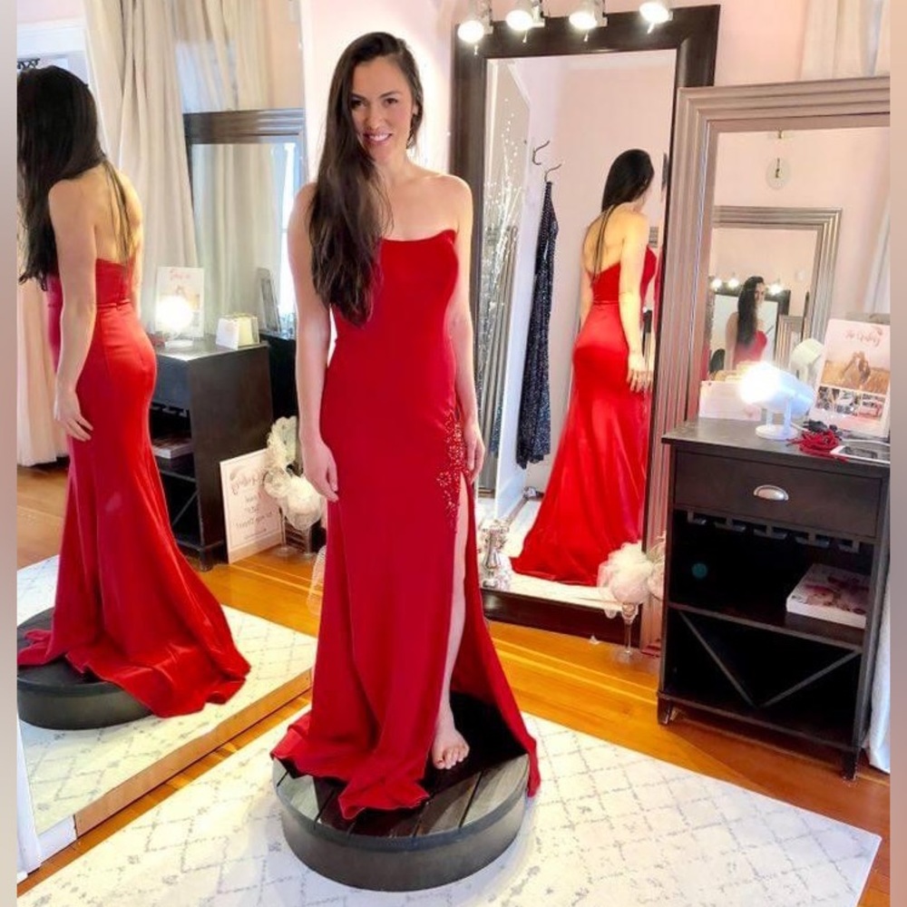 Red floor length ball gown with slit by Claire New York size 6